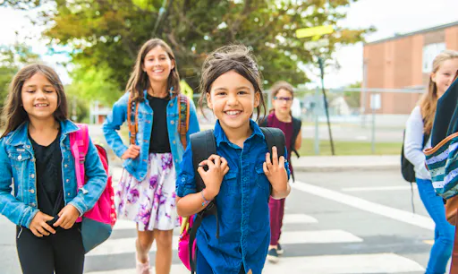 Group of young kids on their way to school.