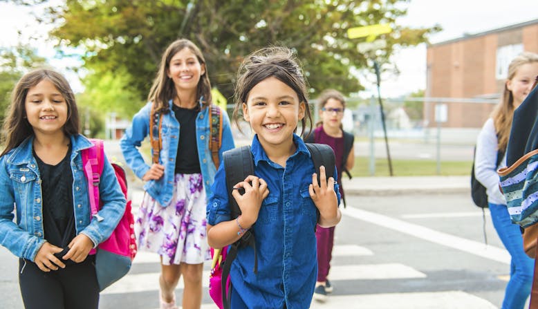 Group of young kids on their way to school.