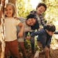 Children laughing and playing in a natural environment