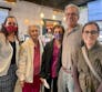 A group of people standing and smiling at a Pstamp Out Psoriatic Disease event.