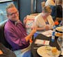 A winner at a Pstamp Out Psoriatic Disease bingo night.