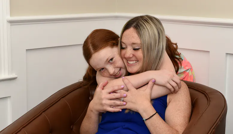 Michel and Leah Tarabocchia embracing.