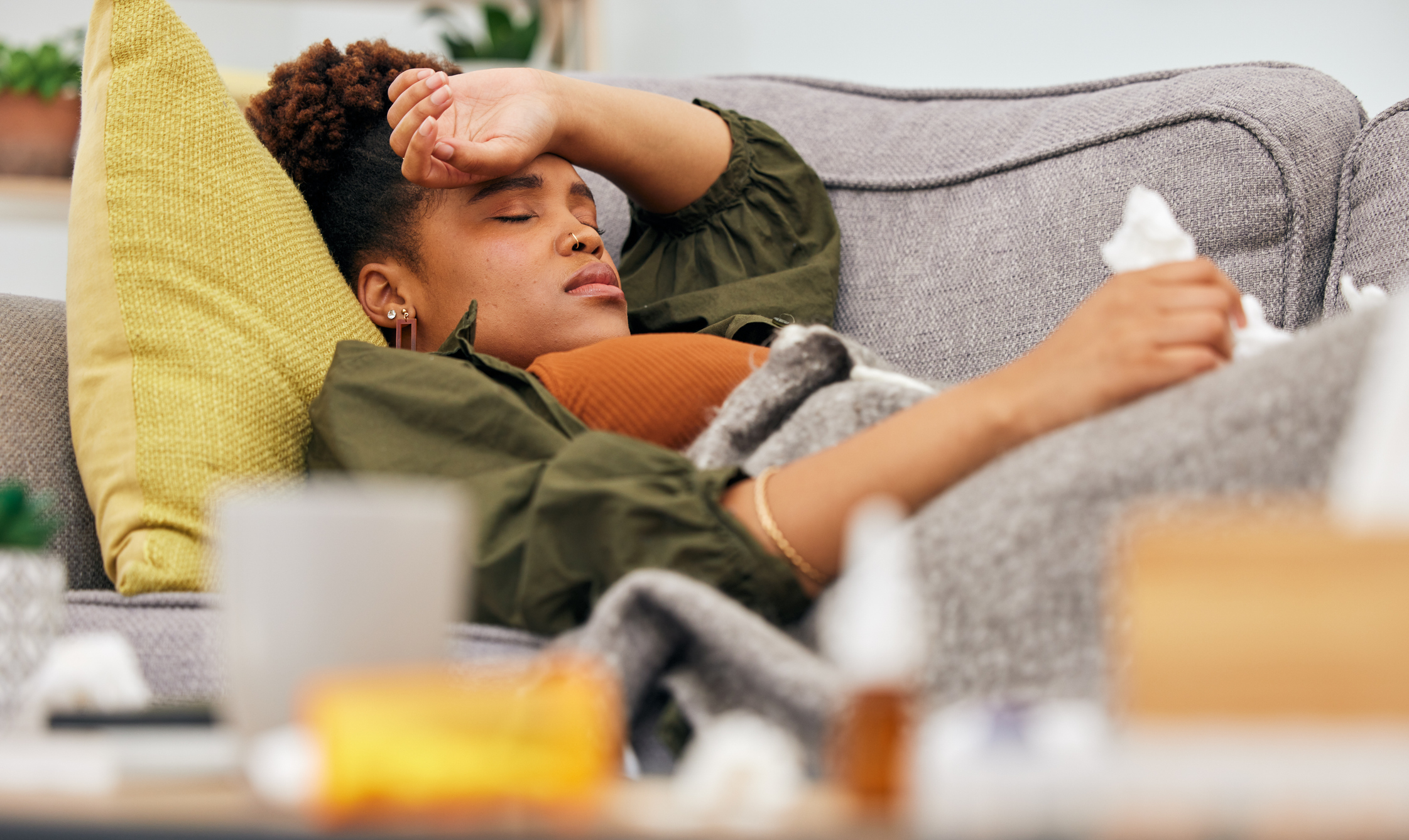 A woman is sick with the flu.