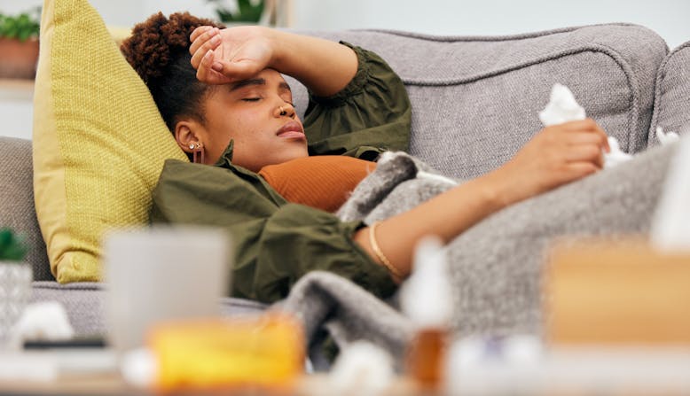 A woman is sick with the flu.