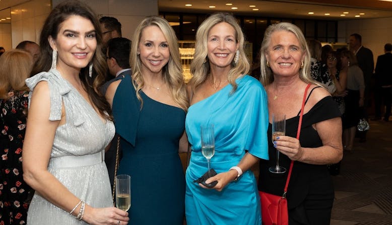 Attendees at the 2024 Commit to Cure Gala smile and pose.