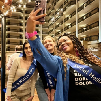 Three women pose for a selfie at the NPF IMPACT Summit.