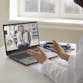 A doctor talks to a patient on the computer. Teledermatology.