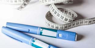 Weight loss medication injectors with a tape measure.