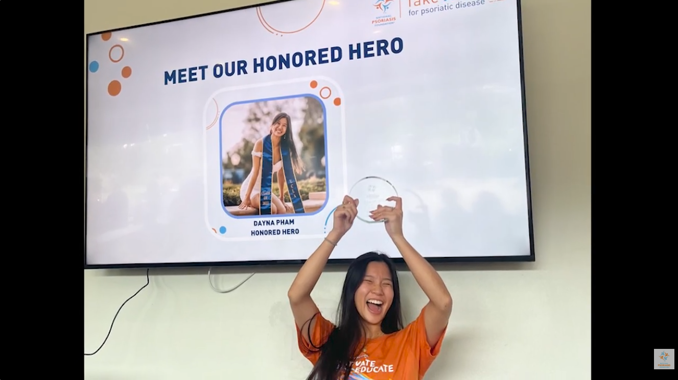 Dayna Pham holds up an award as an NPF Honored Hero.