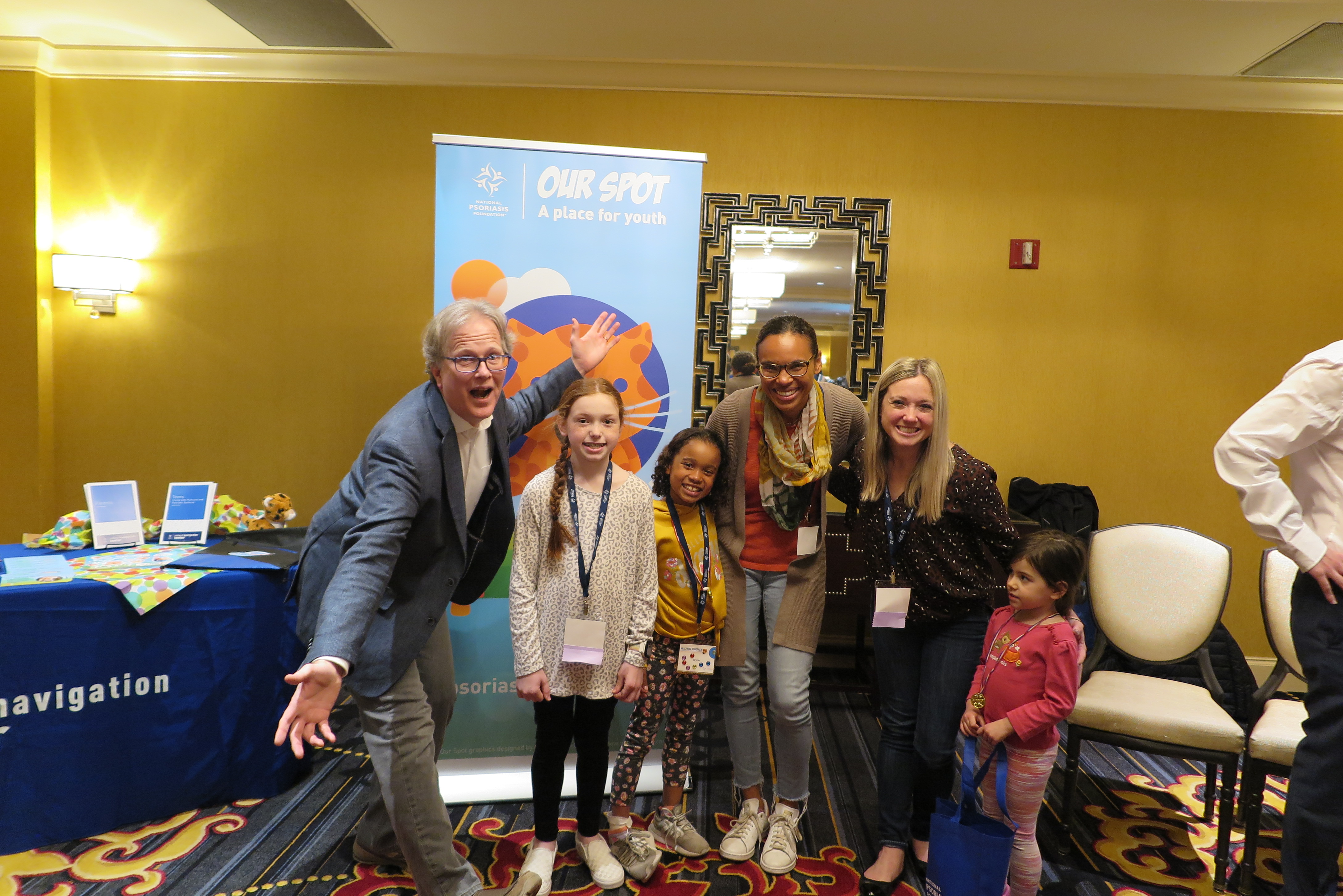 Matt Kiselica, Michel and Leah Tarabocchia, Michelle and Skylar in front of the NPF Our Spot banner at the Healthier Together: Learning for All Ages conference.