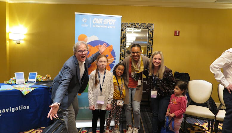 Matt Kiselica, Michel and Leah Tarabocchia, Michelle and Skylar in front of the NPF Our Spot banner at the Healthier Together: Learning for All Ages conference.