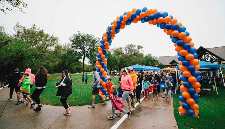 Runners at the beginning of an NPF Run course takes off.