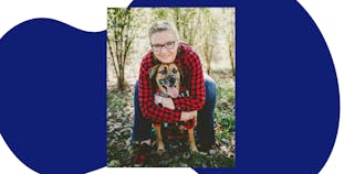 Andrea Klockow with her dog in the woods.