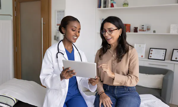 A patient talking to a doctor.