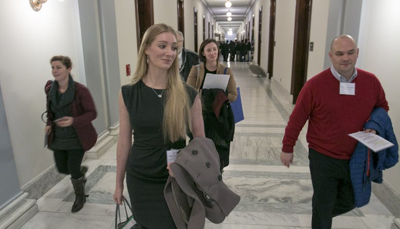 NPF advocates walking in a legislative building.