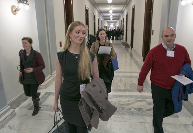 NPF advocates walking in a legislative building.