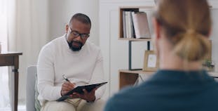 A patient talks to their doctor about their mental health.