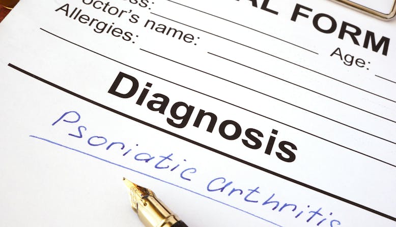 A medical diagnosis chart with psoriatic arthritis written on it.
