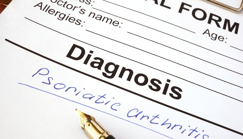 A medical diagnosis chart with psoriatic arthritis written on it. 