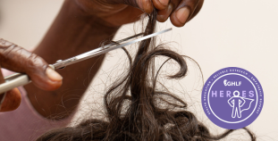 A photo of a person of color cutting brown hair. A graphic of the GHLF HEROES program is overlaid.