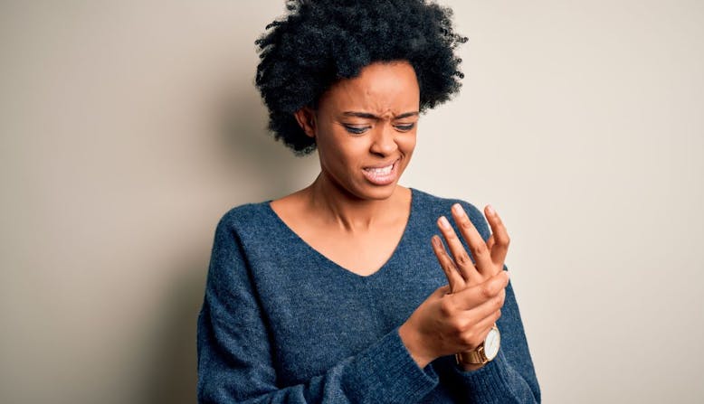 Woman massaging her palm