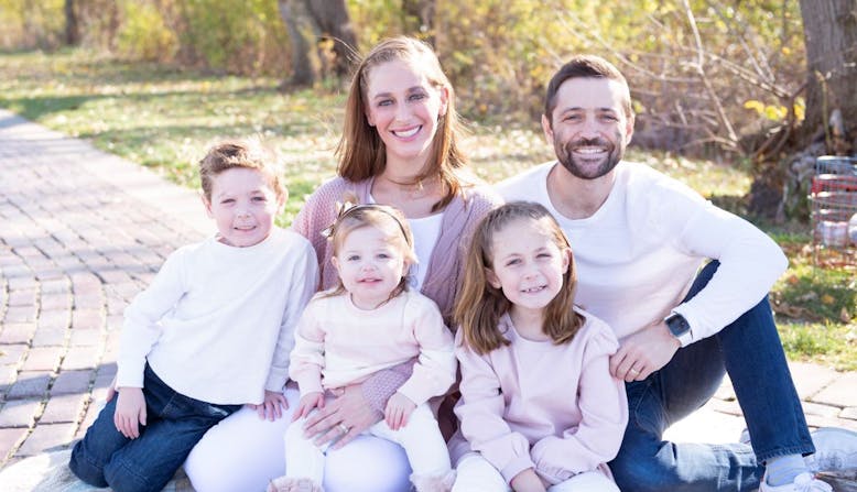 Mike Sayles and his family pose outside.