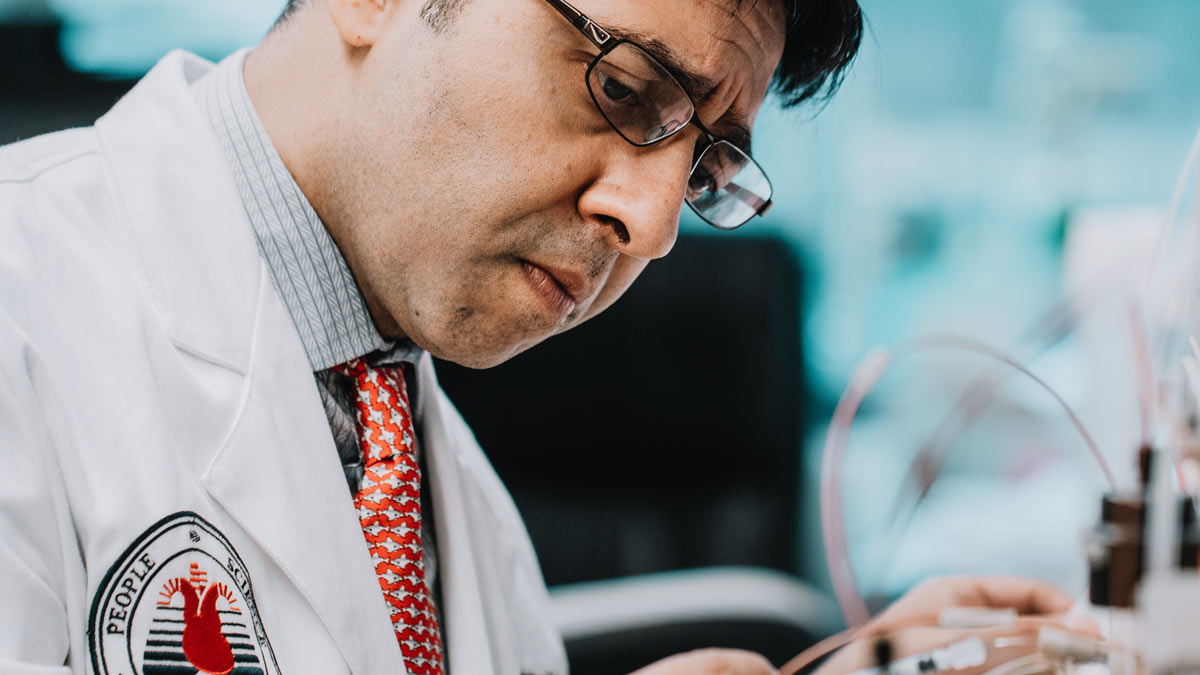 Close-up of a medical researcher observing equipment.