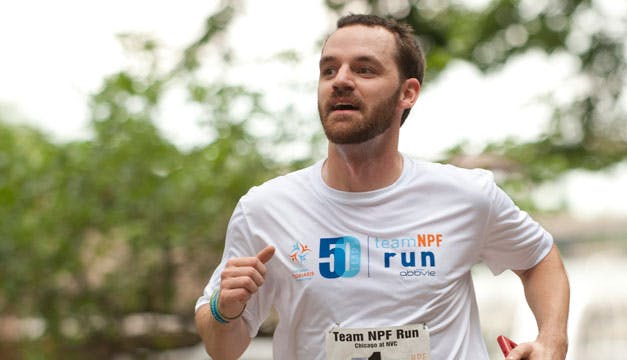 Runner Craig with a Team NPF Run shirt at the NYC Marathon.