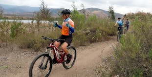 Michelle Racicot on her bike on a mountain trail.