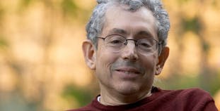 Fred Finkelstein, a filmmaker with longstanding psoriasis and psoriatic arthritis, smiling.
