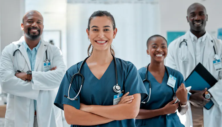 A group of doctors stand in a hospital.