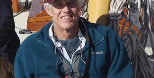 Dudley Dix smiles while on his boat. Read how he saw the silver lining to his psoriasis diagnosis. 