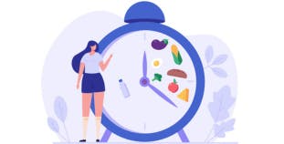 Intermittent fasting concept. A clock shows certain hours are for eating, the rest are only water.