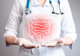 A doctor holding their hands out with a graphic of the intestines over them.