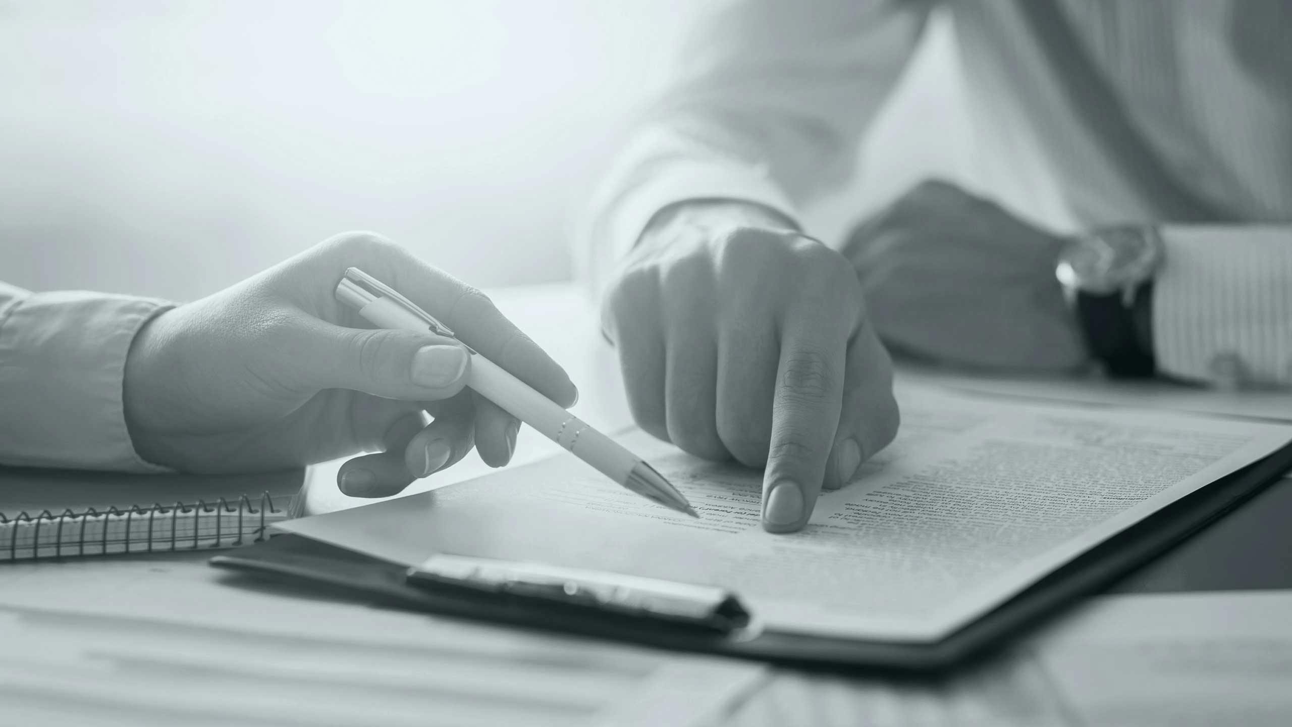 Cropped image of people signing a contract