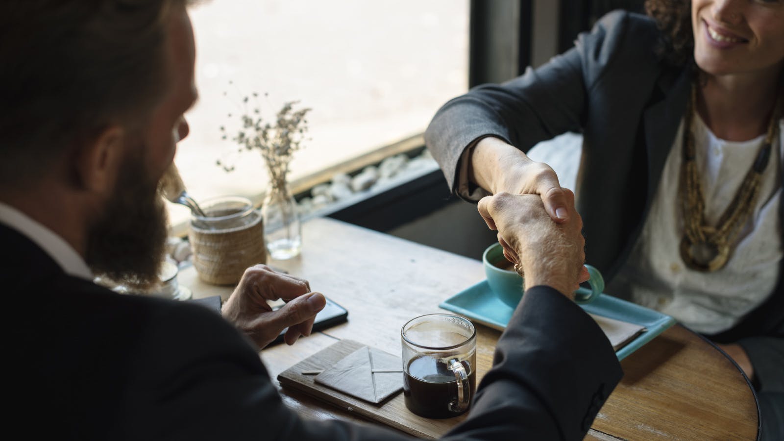 handshake during business meeting 