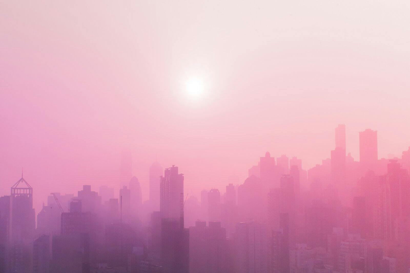 City sky line in a hazy pink colour
