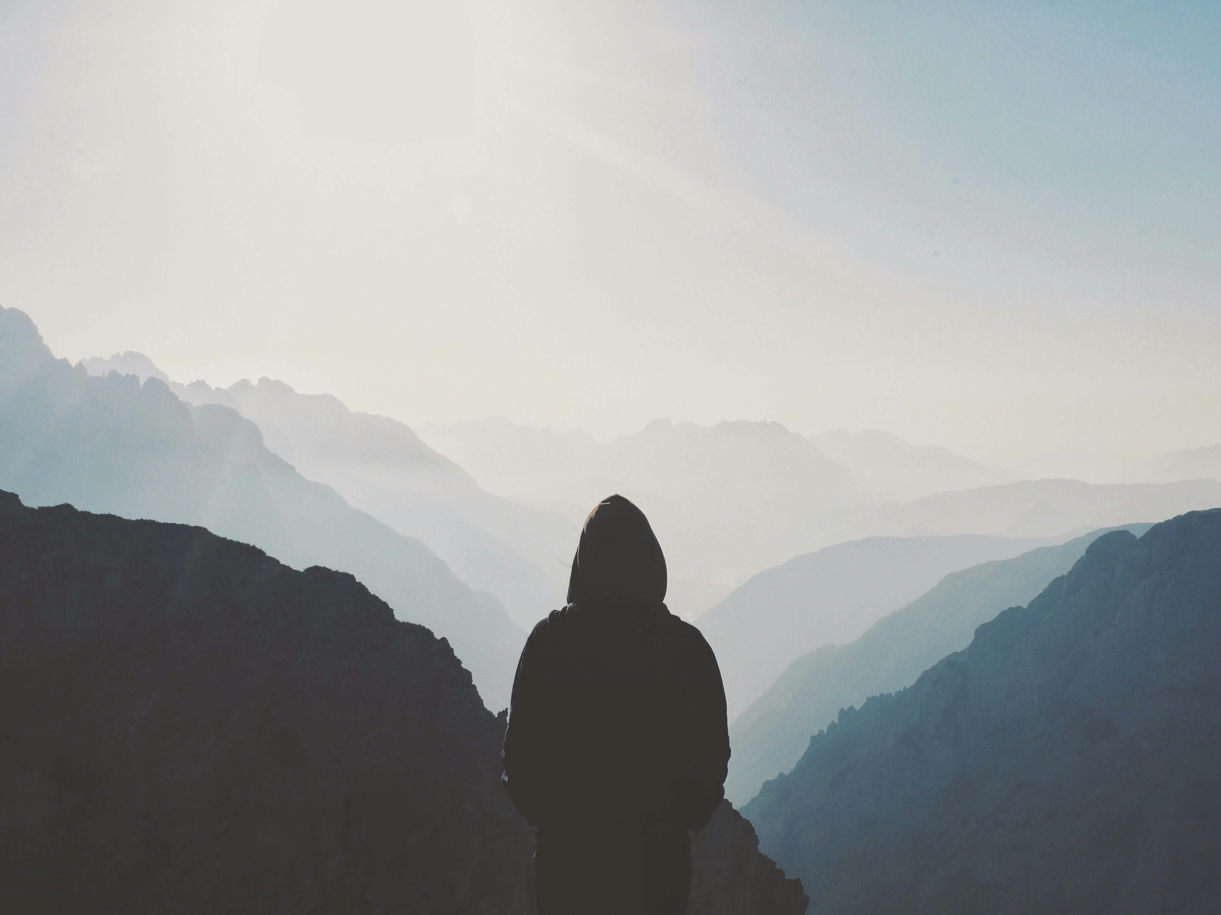 man overlooking mountains 