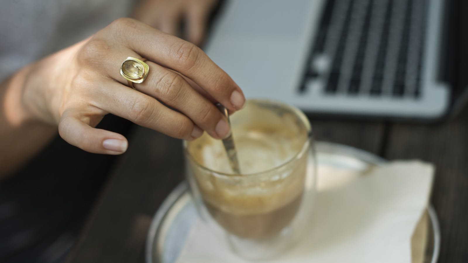 woman stirring a coffee 