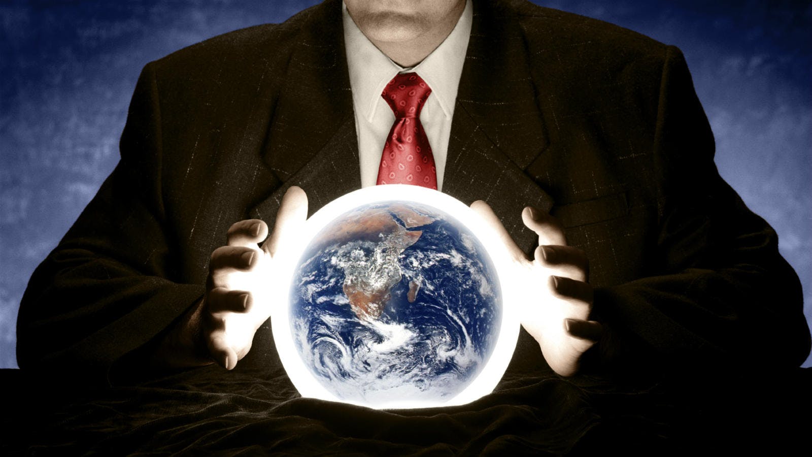 man forecasting future with crystal ball
