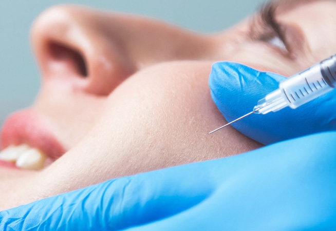 Mature woman receiving dermal filler injections