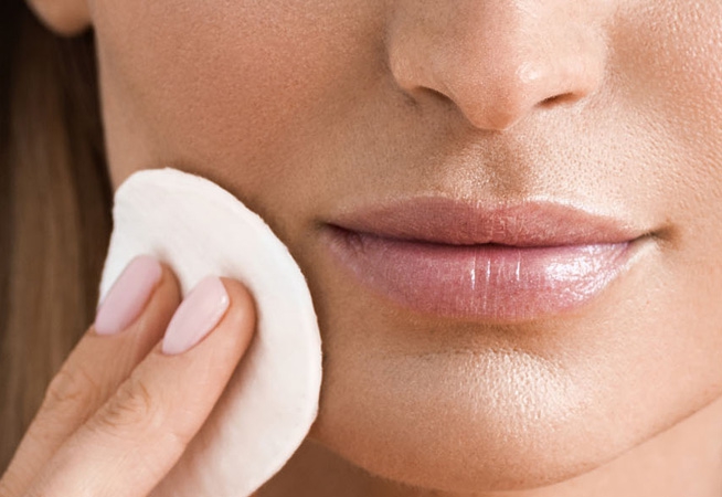 Woman applying anti-ageing skin care