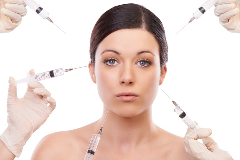 woman being injected with botox and dermal fillers