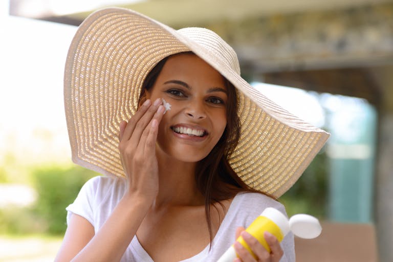 woman apply spf for anti-ageing benefits