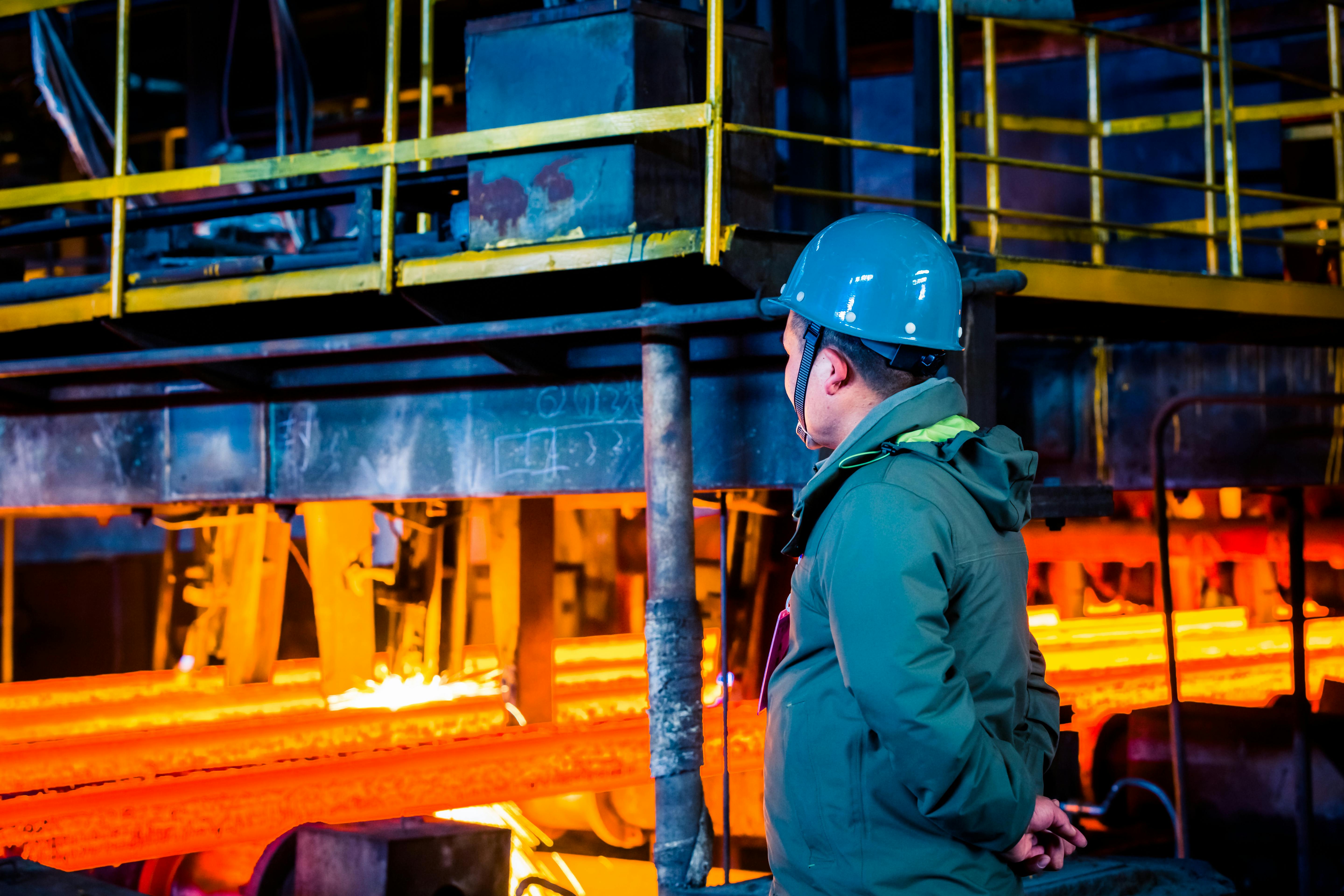 Blue helmet worker inspecting an industrial unit