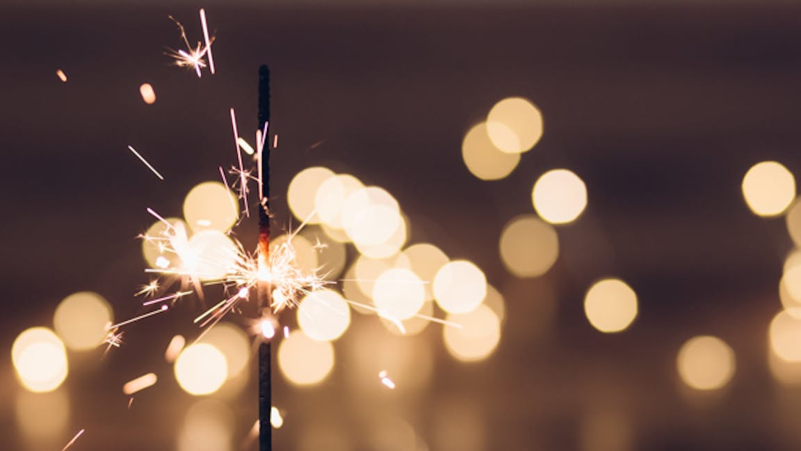 Photo of sparkler sparkling with light flares