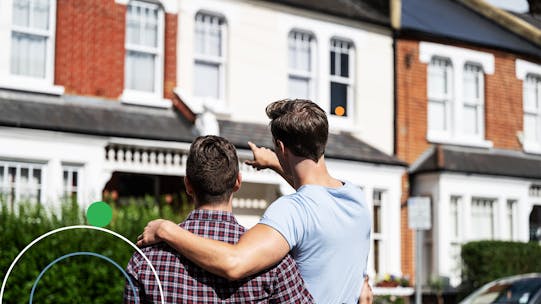 A couple viewing a new house to buy from outside the property in England