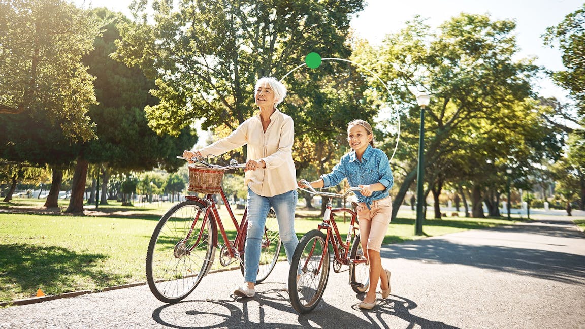 Grandparent and child with bikes