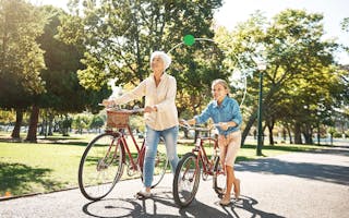 Grandparent and child with biked