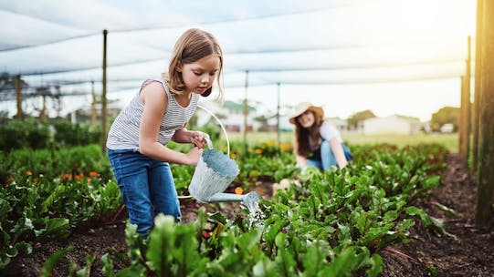 Girl with a watering can